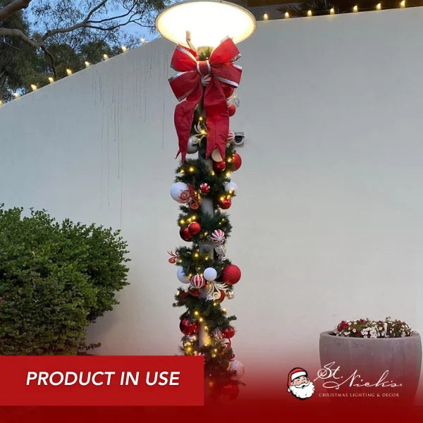 9 foot by 14 inch pre-decorated green garland with red, white, and silver ornaments and warm white LED lights