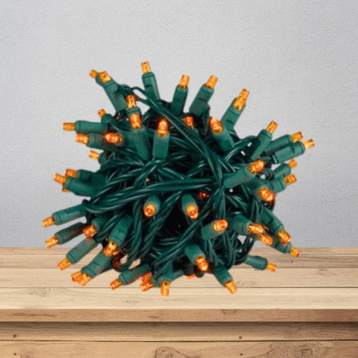 LED Mini Lights 5MM Orange Twinkle on green wire with 6 inch spacing
