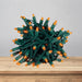 LED Mini Lights 5MM Orange Twinkle on green wire with 6 inch spacing