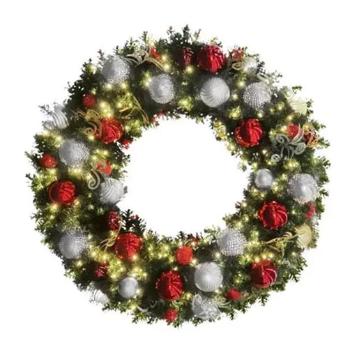 Red, white, and silver pre-decorated Christmas wreath illuminated with warm white lights